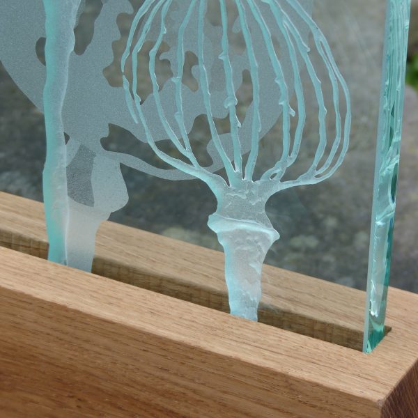 Detail of Poppy design engraved sandblasted glass LED table light by Tim Carter