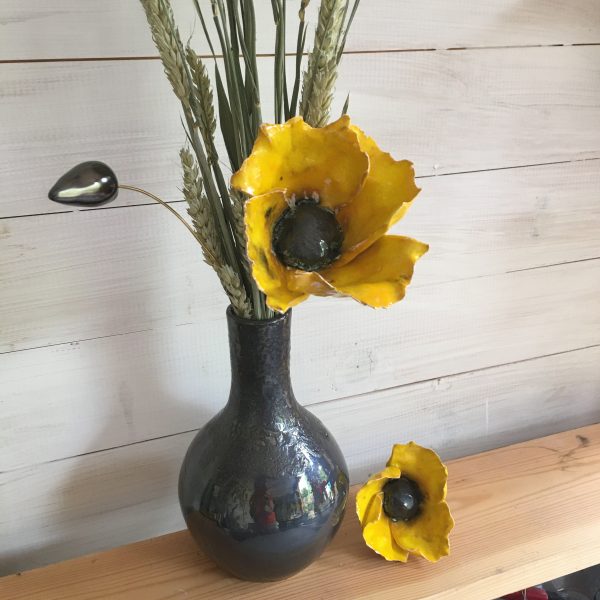 yellow poppy and vase