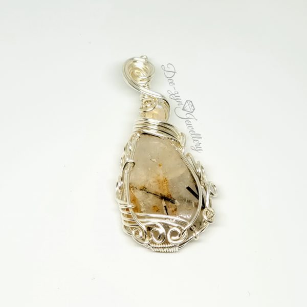Rutilated Quartz and Rainbow Moonstone Captured in a Silver Filled Wire Sculptured Pendant on white background. Flat view